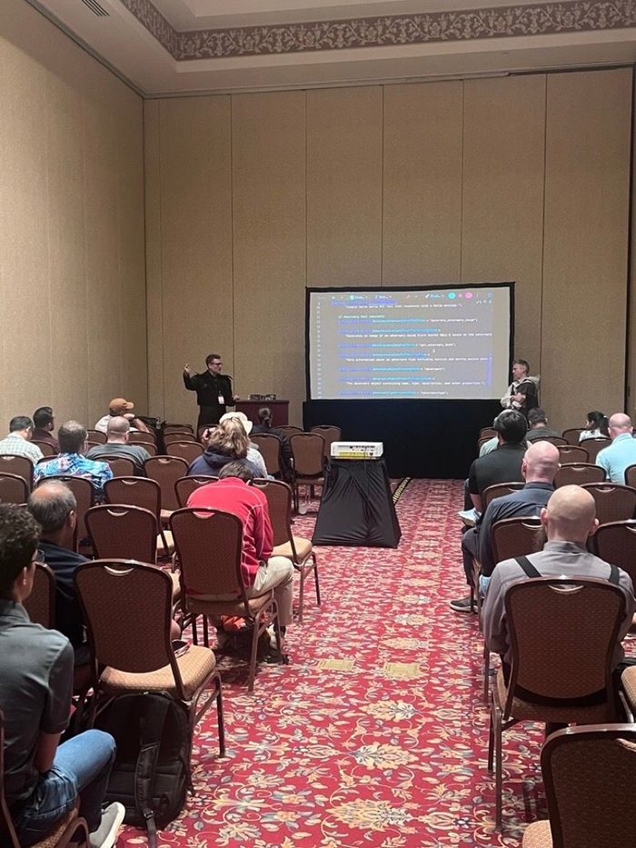 An ArchitectNow engineer presenting a session at the dev up conference